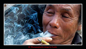 Smoking man, at the hilltribes in Chiang Rai.