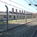 3B Auschwitz,   De spreuk Arbeit macht frei op de toegangspoort v