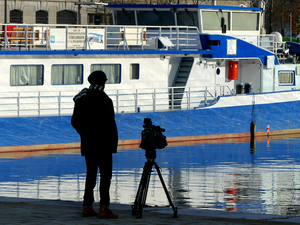 taking a shot by the waterside