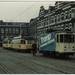 Stationsplein, met rechts een railreiniger , met reclame van Trom