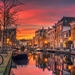 amsterdam-canal-sunset-houses-bicycle-boats-germany