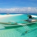 boat_on_tropical_beach_with_white_sand-wallpaper-1680x1050