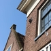 Het zijn rozetten aan huizen in  Monnickendam; daaraan werd de bo
