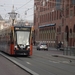 Amsterdam-Damrak. Een begin van Hybride trams Met bovenleiding of