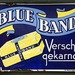 260px-Blue_Band_Versch_Gekarnd,_emaille_reclame_bord