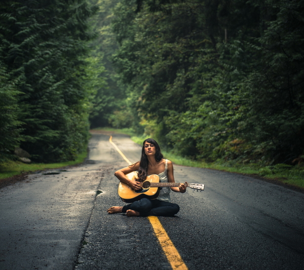 Girl-Playing-Guitar-On-Countryside-Road-1440x1280