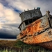 ship_wreck_on_shore_hdr_harbor_clouds_boats-phGE