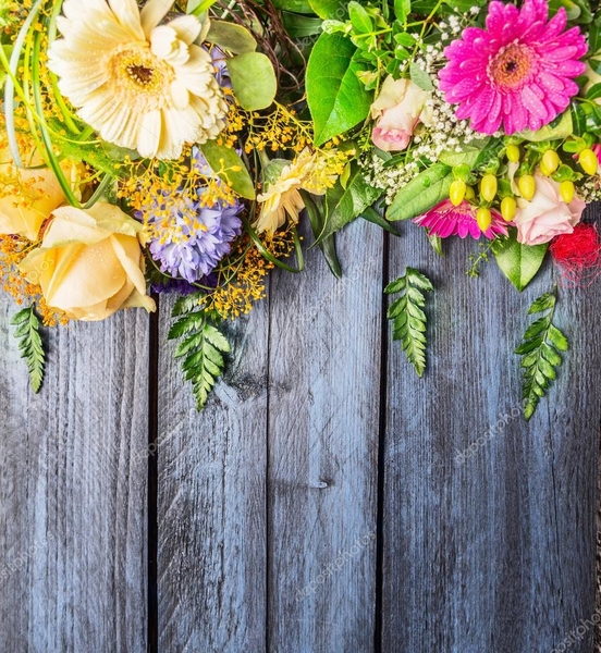 depositphotos_92549324-stock-photo-flowers-on-wooden-background