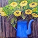 zonnebloemen in koffiekan