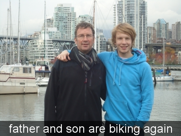 father and son are biking and again