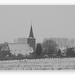 onze kerk van Everbeek beneden vanuit het veld  gezien