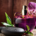 foto-van-een-paarse-orchidee-en-een-flesje-parfum-hd-bloemen-wall