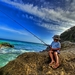 hd-wallpaper-with-boy-fishing-on-a-rock-at-the-beach