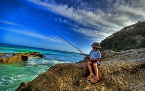 hd-wallpaper-with-boy-fishing-on-a-rock-at-the-beach