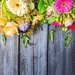 depositphotos_92549324-stock-photo-flowers-on-wooden-background