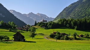 Switzerland-mountains-Alps-valley-grass-road-house-trees_1600x900