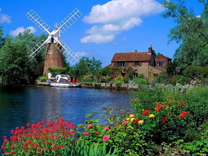 rivier-windmolen-natuur-bloemen-achtergrond